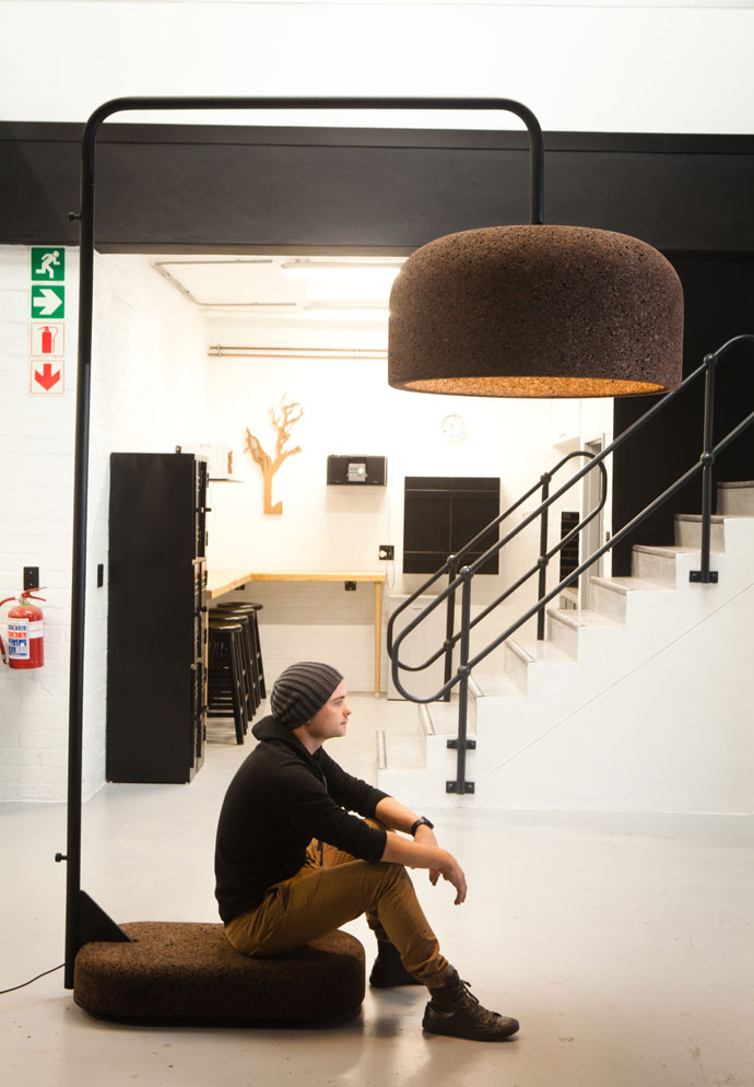 Laurie perches on the base of his new oversized cork pendant. 
